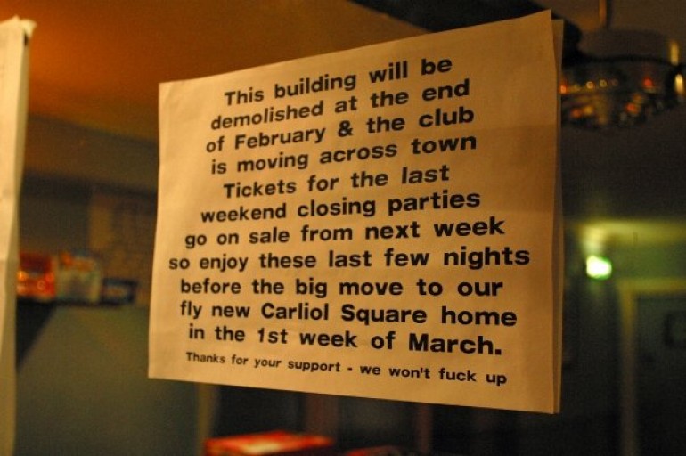 A printed sign detailing the Club move